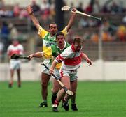 23 July 2000; Kieran McKeever of Derry in action against Johnny Pilkington and Johnny Dooley of Offaly during the Guinness All-Ireland Senior Hurling Championship Quarter-Final match between Offaly and Derry at Croke Park in Dublin. Photo by Damien Eagers/Sportsfile