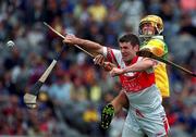 23 July 2000; Ronan McCloskey of Derry in action against Ger Oakley of Offaly during the Guinness All-Ireland Senior Hurling Championship Quarter-Final match between Offaly and Derry at Croke Park in Dublin. Photo by Ray Lohan/Sportsfile