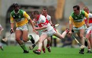 23 July 2000; Benny Ward of Derry in action against Gary Hannify, left, and Johnny Pilkington of Offaly during the Guinness All-Ireland Senior Hurling Championship Quarter-Final match between Offaly and Derry at Croke Park in Dublin. Photo by Brendan Moran/Sportsfile