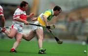 23 July 2000; Johnny Pilkington of Offaly in action against Kieran McKeever of Derry during the Guinness All-Ireland Senior Hurling Championship Quarter-Final match between Offaly and Derry at Croke Park in Dublin. Photo by Brendan Moran/Sportsfile
