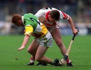 23 July 2000; Simon Whelahan of Offaly in action against John O'Dwyer of Derry during the Guinness All-Ireland Senior Hurling Championship Quarter-Final match between Offaly and Derry at Croke Park in Dublin. Photo by Damien Eagers/Sportsfile