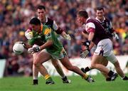30 July 2000; Seamus Quinn of Leitrim is tackled by Sean O'Domhnaill, left, and Seán Óg de Paor of Galway during the Bank of Ireland Connacht Senior Football Championship Final between Galway and Leitrim at Dr Hyde Park in Roscommon. Photo by David Maher/Sportsfile
