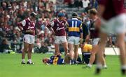 23 July 2000; Tipperary's John Leahy is attended to by the team doctor after picking up an injury during the Guinness All-Ireland Senior Hurling Championship Quarter-Final between Tipperary and Galway at Croke Park in Dublin. Photo by Brendan Moran/Sportsfile