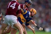23 July 2000; Paul Ormonde of Tipperary is tackled by Alan Kerins and Ollie Fahy, 14, of Galway during the Guinness All-Ireland Senior Hurling Championship Quarter-Final between Tipperary and Galway at Croke Park in Dublin. Photo by Brendan Moran/Sportsfile