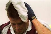 23 July 2000; Galway's Tommy Joyce holds a towel over his head after picking up an injuy during the Guinness All-Ireland Senior Hurling Championship Quarter-Final between Tipperary and Galway at Croke Park in Dublin. Photo by David Maher/Sportsfile