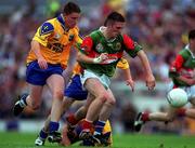 30 July 2000; Alan Dillon of Mayo in action against John Nolan of Roscommon during the Connacht Minor Football Championship Final between Roscommon and Mayo at Dr Hyde Park in Roscommon. Photo by Ray Lohan/Sportsfile