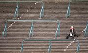 29 July 2000; A spectator watches the action from the terraces during the Dublin International Games at at Morton Stadium in Santry, Dublin. Photo by Brendan Moran/Sportsfile