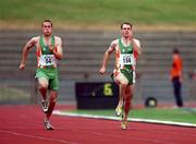 29 July 2000; Mark Howard, 54, on his way to finishing second in the men's 100m event, from eventual third place Tom Comyns, 156, during the Dublin International Games at at Morton Stadium in Santry, Dublin. Photo by Brendan Moran/Sportsfile