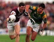 30 July 2000; Jason Killeen of Galway is tackled by Seamus Quinn of Leitrim during the Bank of Ireland Connacht Senior Football Championship Final between Galway and Leitrim at Dr Hyde Park in Roscommon. Photo by David Maher/Sportsfile
