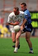 30 July 2000; Willie McCreery of Kildare in action against Paul Curran of Dublin during the Bank of Ireland Leinster Senior Football Championship Final between Dublin and Kildare at Croke Park in Dublin. Photo by Damien Eagers/Sportsfile