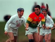 30 January 2000; Niall Banbury of Carlow in action against Joe Dempsey of Kildare during the Keogh Cup match between Kildare and Carlow at Naas GAA Ground in Kildare. Photo by Damien Eagers/Sportsfile
