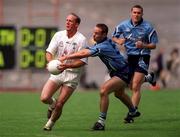 30 July 2000; Willie McCreery of Kildare is tackled by Paul Curran of Dublin during the Bank of Ireland Leinster Senior Football Championship Final between Dublin and Kildare at Croke Park in Dublin. Photo by Damien Eagers/Sportsfile