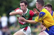 30 July 2000; Alan Burke of Mayo in action against Seamus O'Neill of Roscommon during the Connacht Minor Football Championship Final between Roscommon and Mayo at Dr Hyde Park in Roscommon. Photo by David Maher/Sportsfile