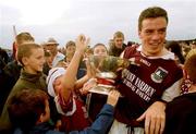 30 July 2000; Galway captain Padraic Joyce with the Nestor Cup is greeted on the pitch by supporters following the Bank of Ireland Connacht Senior Football Championship Final between Galway and Leitrim at Dr Hyde Park in Roscommon. Photo by David Maher/Sportsfile