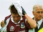30 July 2000; Galway's Tommy Joyce is led away for attention to a head injury during the opening minutes of the Bank of Ireland Connacht Senior Football Championship Final between Galway and Leitrim at Dr Hyde Park in Roscommon. Photo by David Maher/Sportsfile