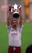 17 March 2000; Athenry captain Joe Rabitte lifts the Tommy Moore cup following the AIB All-Ireland Senior Club Hurling Championship Final between Athenry, Galway, and St Josephs Doorabarefield, Clare, at Croke Park in Dublin. Photo by Ray McManus/Sportsfile