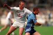 30 July 2000; Peadar Andrews of Dublin breaks through the tackle of Willie McCreery of Kildare during the Bank of Ireland Leinster Senior Football Championship Final between Dublin and Kildare at Croke Park in Dublin. Photo by Damien Eagers/Sportsfile