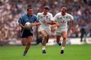 30 July 2000; Ciaran Whelan of Dublin runs clear of Dermot Earley and Willie McCreery of Kildare during the Bank of Ireland Leinster Senior Football Championship Final between Dublin and Kildare at Croke Park in Dublin. Photo by Ray McManus/Sportsfile
