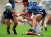 30 July 2000; John Finn of Kildare hand passes the ball away despite the attention of Colin Moran of Dublin during the Bank of Ireland Leinster Senior Football Championship Final between Dublin and Kildare at Croke Park in Dublin. Photo by Ray McManus/Sportsfile