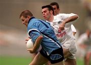 30 July 2000; Dessie Farrell of Dublin breaks through the tackle of Ken Doyle of Kildare during the Bank of Ireland Leinster Senior Football Championship Final between Dublin and Kildare at Croke Park in Dublin. Photo by Damien Eagers/Sportsfile
