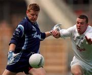30 July 2000; Dublin goalkeeper David Byrne clears the ball despite the attention of Ronan Sweeney of Kildare during the Bank of Ireland Leinster Senior Football Championship Final between Dublin and Kildare at Croke Park in Dublin. Photo by Damien Eagers/Sportsfile