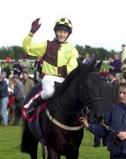 1 August 2000; Jockey Tom Queally celebrates after winning the McDonogh European Breeders Fund Handicap, onboard Tushna,  during the second day of the Galway Racing Festival at Galway Racecourse in Ballybrit, Galway. Photo by Matt Browne/Sportsfile