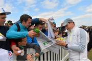 26 May 2015; Rory McIlroy signs autographs for supporters on the putting green. Dubai Duty Free Irish Open Golf Championship 2015, Practice Day 2. Royal County Down Golf Club, Co. Down. Picture credit: Ramsey Cardy / SPORTSFILE