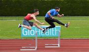 27 May 2015; Matthew Behan, CUS, Dublin, left, is put through his paces by International hurdler Ger O'Donnell ahead of the GloHealth Irish Schools Track and Field Championships at Tullamore Harriers Stadium, Tullamore, Co. Offaly. Picture credit: Stephen McCarthy / SPORTSFILE