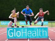 27 May 2015; International hurdler Ger O'Donnell puts schools athletes Elizabeth Morland, Dunshaughlin CS, and Matthew Behan, CUS, Dublin, right, through their paces ahead of the GloHealth Irish Schools Track and Field Championships at Tullamore Harriers Stadium, Tullamore, Co. Offaly. Picture credit: Stephen McCarthy / SPORTSFILE