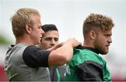 27 May 2015; Ireland's Ian Madigan gets some assistance with his GPS device from team-mate Luke Marshall before the captain's run. Thomond Park, Limerick. Picture credit: Diarmuid Greene / SPORTSFILE