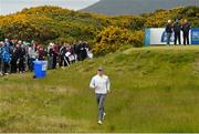 27 May 2015; Rory McIlroy takes a shortcut to the fairway on the 12th hole. Dubai Duty Free Irish Open Golf Championship 2015, Pro-Am. Royal County Down Golf Club, Co. Down. Picture credit: Ramsey Cardy / SPORTSFILE