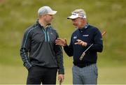 27 May 2015; Darren Clarke, right, speaking to Stephen Ferris, former Ulster, Ireland and British Lions rugby player, on the 1st green. Dubai Duty Free Irish Open Golf Championship 2015, Pro-Am. Royal County Down Golf Club, Co. Down. Picture credit: Oliver McVeigh / SPORTSFILE
