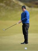 28 May 2015; Paul McGinley, Ireland, watches his putt on the 5th green. Dubai Duty Free Irish Open Golf Championship 2015, Day 1. Royal County Down Golf Club, Co. Down. Picture credit: Brendan Moran / SPORTSFILE