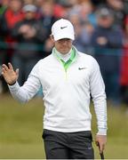 29 May 2015; Rory McIlroy, Northern Ireland, acknowledges the applause from the gallery on the 18th green after finishing his round with a 71. Dubai Duty Free Irish Open Golf Championship 2015, Day 2. Royal County Down Golf Club, Co. Down. Picture credit: Brendan Moran / SPORTSFILE