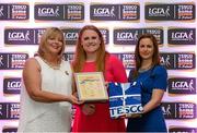 29 May 2015; Amber Barrett, Donegal, centre, is presented with her TESCO Team of the League award for Division 2 by Marie Hickey, LGFA President, left, and Lynn Moynihan, Tesco Marketing Manager. TESCO Team of the League, Croke Park, Dublin. Picture credit: Piaras Ó Mídheach / SPORTSFILE
