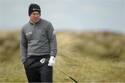 30 May 2015; Richie Ramsay, Scotland, checks the lie before taking a bunker shot at the 2nd green. Dubai Duty Free Irish Open Golf Championship 2015, Day 3. Royal County Down Golf Club, Co. Down. Picture credit: Brendan Moran / SPORTSFILE