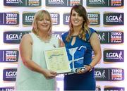 29 May 2015; Michelle Guinan, Offaly, right, is presented with her TESCO Team of the League award for Division 4 by Marie Hickey, LGFA President. TESCO Team of the League, Croke Park, Dublin. Picture credit: Piaras Ó Mídheach / SPORTSFILE