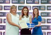 29 May 2015; Yvette Culhane, Limerick, centre, is presented with her TESCO Team of the League award for Division 4 by Marie Hickey, LGFA President, left, and Lynn Moynihan, Tesco Marketing Manager. TESCO Team of the League, Croke Park, Dublin. Picture credit: Piaras Ó Mídheach / SPORTSFILE