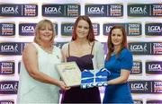 29 May 2015; Niamh Richardson, Limerick, centre, is presented with her TESCO Team of the League award for Division 4 by Marie Hickey, LGFA President, left, and Lynn Moynihan, Tesco Marketing Manager. TESCO Team of the League, Croke Park, Dublin. Picture credit: Piaras Ó Mídheach / SPORTSFILE