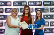 29 May 2015; Róisín Egan, Offaly, centre, is presented with her TESCO Team of the League award for Division 4 by Marie Hickey, LGFA President, left, and Lynn Moynihan, Tesco Marketing Manager. TESCO Team of the League, Croke Park, Dublin. Picture credit: Piaras Ó Mídheach / SPORTSFILE