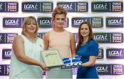 29 May 2015; Kym Furey, Offaly, centre, is presented with her TESCO Team of the League award for Division 4 by Marie Hickey, LGFA President, left, and Lynn Moynihan, Tesco Marketing Manager. TESCO Team of the League, Croke Park, Dublin. Picture credit: Piaras Ó Mídheach / SPORTSFILE