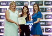 29 May 2015; Dymphna O'Brien, Limerick, centre, is presented with her TESCO Team of the League award for Division 4 by Marie Hickey, LGFA President, left, and Lynn Moynihan, Tesco Marketing Manager. TESCO Team of the League, Croke Park, Dublin. Picture credit: Piaras Ó Mídheach / SPORTSFILE