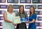 29 May 2015; Laura Hogan, Wicklow, centre, is presented with her TESCO Team of the League award for Division 4 by Marie Hickey, LGFA President, left, and Lynn Moynihan, Tesco Marketing Manager. TESCO Team of the League, Croke Park, Dublin. Picture credit: Piaras Ó Mídheach / SPORTSFILE