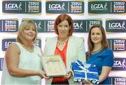 29 May 2015; Linda Martin, Donegal, centre, is presented with her TESCO Team of the League award for Division 1 by Marie Hickey, LGFA President, left, and Lynn Moynihan, Tesco Marketing Manager. TESCO Team of the League, Croke Park, Dublin. Picture credit: Piaras Ó Mídheach / SPORTSFILE