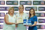 29 May 2015; Bríd Stack, Cork, centre, is presented with her TESCO Team of the League award for Division 1 by Marie Hickey, LGFA President, left, and Lynn Moynihan, Tesco Marketing Manager. TESCO Team of the League, Croke Park, Dublin. Picture credit: Piaras Ó Mídheach / SPORTSFILE