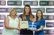 29 May 2015; Annie Walsh, Cork, centre, is presented with her TESCO Team of the League award for Division 1 by Marie Hickey, LGFA President, left, and Lynn Moynihan, Tesco Marketing Manager. TESCO Team of the League, Croke Park, Dublin. Picture credit: Piaras Ó Mídheach / SPORTSFILE
