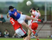 19 July 2008; Stuart Reynolds and Mick Fanning, left, Louth, in action against Sean Cavanagh, Tyrone. GAA Football All-Ireland Senior Championship Qualifier - Round 1, Louth v Tyrone, Drogheda, Co. Louth. Picture credit: Brian Lawless / SPORTSFILE