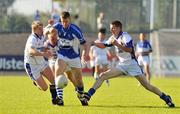 19 July 2008; Donal Kingston, Laois, in action against Paddy Dowd, left, Pádraig Berry and Noel Farrell, Longford. GAA Football All-Ireland Senior Championship Qualifier, Round 1, Longford v Laois. Pearse Park, Longford. Picture credit: Ray Lohan / SPORTSFILE *** Local Caption ***