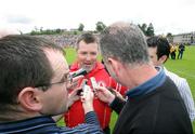 20 July 2008; A happy Tyrone manager Raymond Munroe, talks to the press after the game. ESB Ulster Minor Football Championship Final, Tyrone v Monaghan, St Tighearnach's Park, Clones, Co. Monaghan. Picture credit: Oliver McVeigh / SPORTSFILE
