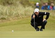 30 May 2015;  Padraig Harrington, Ireland, looking for the line on his putt on the 5th Green. Dubai Duty Free Irish Open Golf Championship 2015, Day 3. Royal County Down Golf Club, Co. Down. Picture credit: Oliver McVeigh / SPORTSFILE